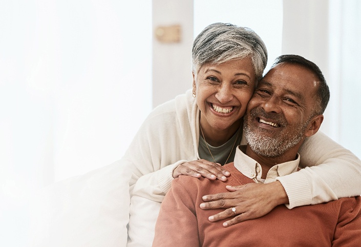Happy middle-aged couple with dentures in West Roxbury