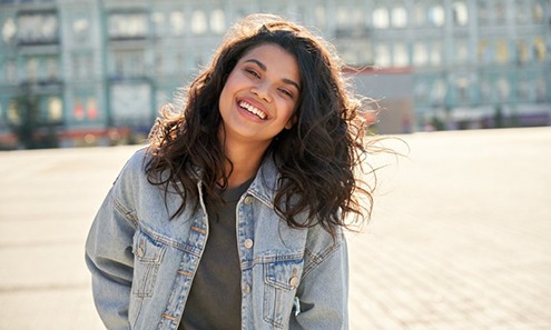 Lady smiles outdoors