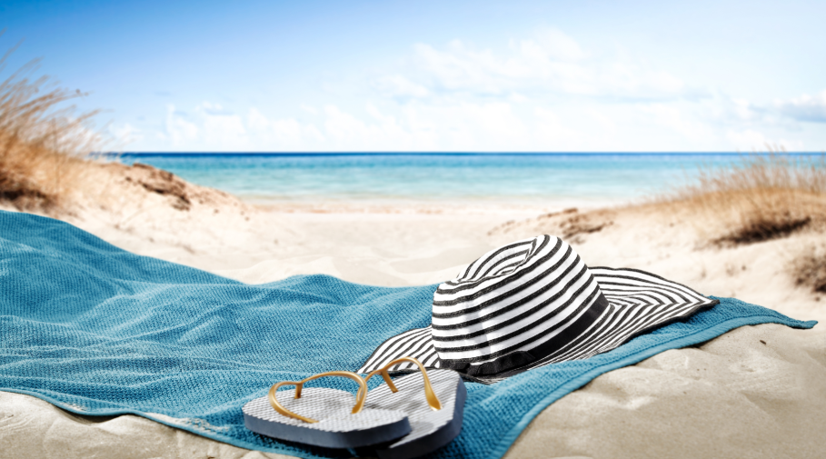 Beach blanket with hat and flip flops